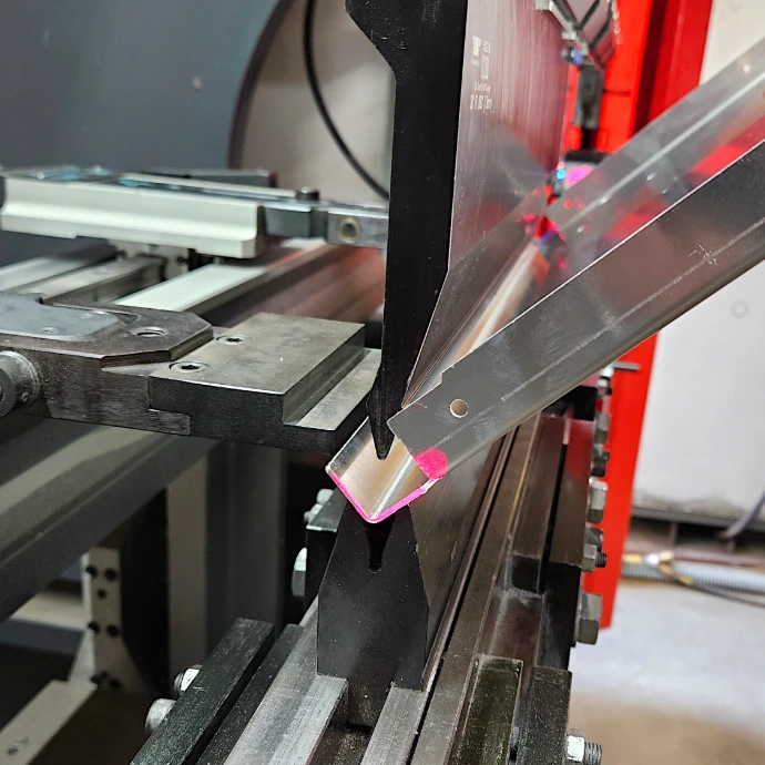 A part being bent on a press brake