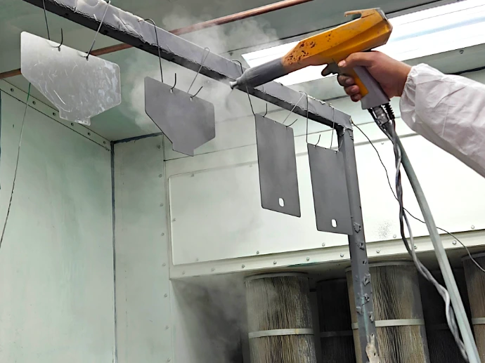 Parts being painted with powder coating.