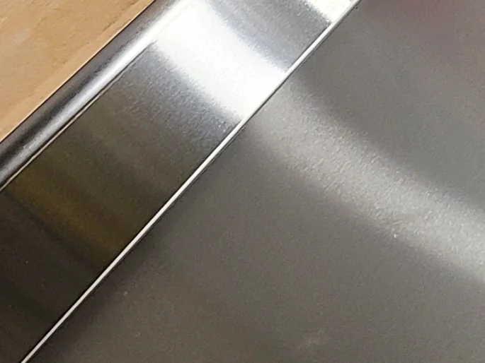 A grained #4 finish on stainless steel.